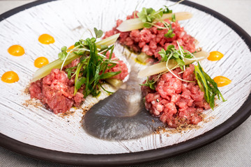 tasty Steak tartare (Raw beef) - classic steak tartare on white plate