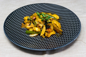 wok fried chicken stir fry with sweet peppers and chinese vegetables