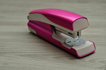 A pink stapler