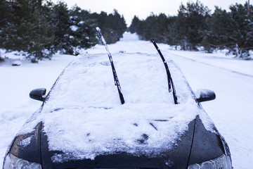 concept - close-up of a car in the snow