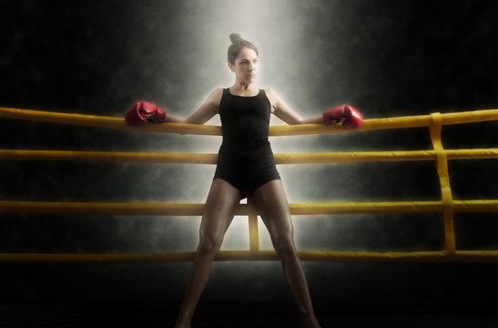Portrait of woman training gym boxing ring