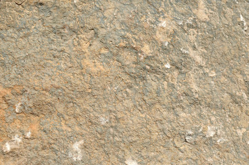 Rustic stone wall of an old coastal village house