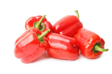 Five ripe red sweet peppers isolated on white