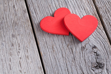 Fototapeta na wymiar Valentine background with handmade glitter hearts on rustic wood