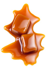 Toffee caramel candies close-up isolated on white background with copy space, macro..