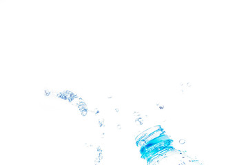 Bottle opening with water splashing isolated on white background.