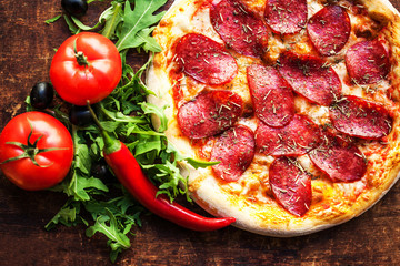 Pizza with tomatoes, cheese, pepper, herbs and olive  Ready to Eat. Fresh baked pepperoni pizza.
