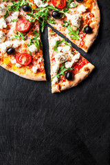 Hot pizza slice with melted mozzarella cheese and tomato on black concrete background.  Pizza Ready...