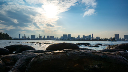 Tokyo cityscape with setting sun and chain