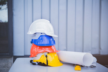 Fototapeta premium Safety helmet stacking on the table at the construction site