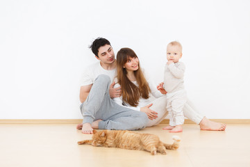 Happy family on white wall backgroung