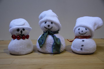 three puppets like snowmans