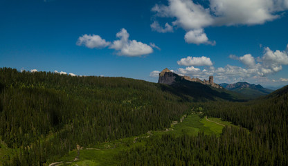 West Fork Cimarron River leads to Chimney Rock and Courthouse Mountain Aerial Panorama