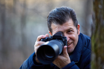 Photographer with camera outdoor