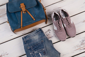 Jeans, sneakers and backpack