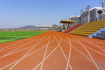 Fototapeta premium Track and field red plastic runway