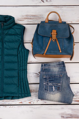 Wash jeans and leather backpack