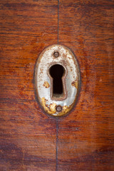 Close-up shot of an old scratched keyhole