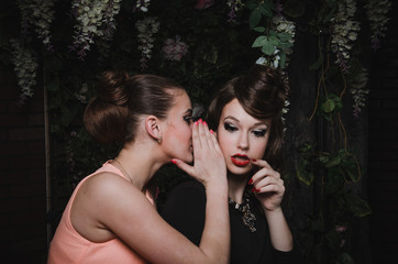 Happy portrait of romantic beautiful couple of pretty woman with hairstyle, fashion make up, red lips, vintage dress. Girls friend smilling.