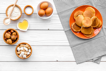 Ingredients for cook american pancakes on white wooden background top view copy space
