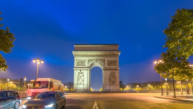 Paris city skyline night to day timelapse at Arc de Triomphe and Champs Elysees, Paris, France 4K Time lapse