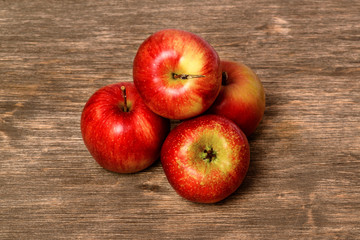 Juicy red apple on an old wooden background
