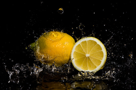 Lemon water splash in black