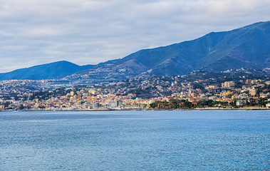 Fototapeta na wymiar View of the Italian coast with the city of Sanremo in the background. This town is famous for the cultivation of flowers and the annual Italian song festival.