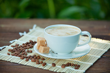 coffee in coffee cup with natural grains