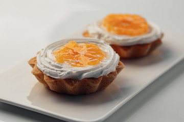 tartlets with cream and tangerines