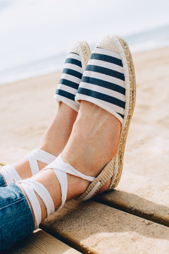 Detail of summer sandals on the beach.