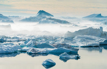Stranded icebergs at the mouth of the Icefjord near Ilulissat, Greenland - obrazy, fototapety, plakaty