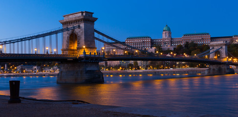 Fototapeta na wymiar Image of Chain Bridge near Buda Fortress in evening illumination of Hungary
