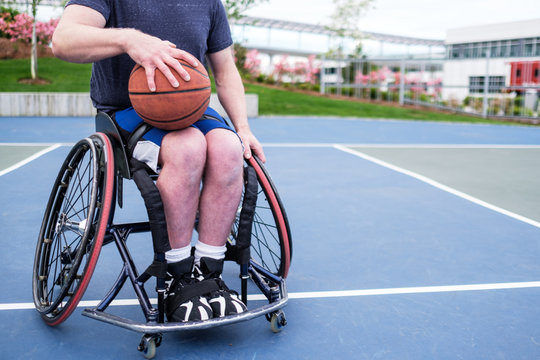 Active Disabled Athlete Practicing Wheelchair Basketball