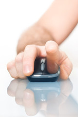 Human hand with computer mouse in hand on smooth surface close-up