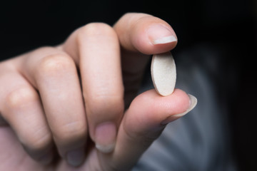 pill in human's hand