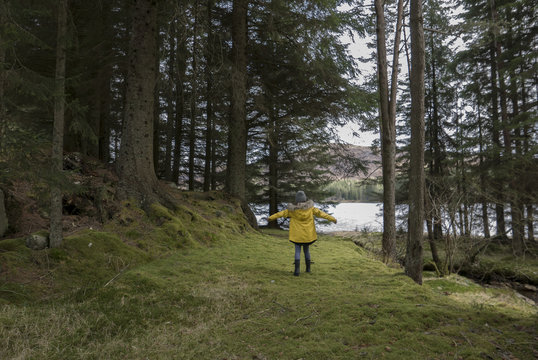 Girl on loch-side road in the highlands