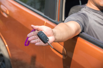 man in the car give the keys