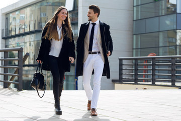 Business people walking in the street.
