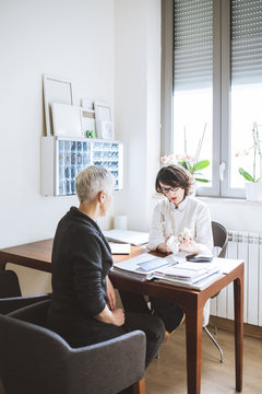 Physician Talking To Her Patient