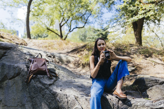 Young Girl With a Vintage Film Camera In Central Park. New York