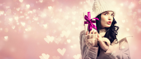 Young woman holding a Christmas gift box