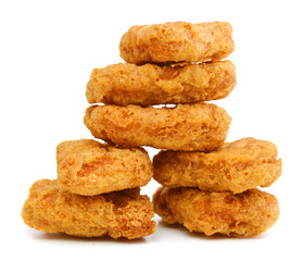 Macro of fried chicken nuggets on white background