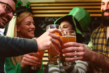 Group of Friends Celebrating St Patrick's Day in Beer Pub