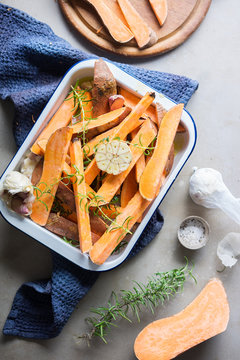 Sweet potato fries being prepared for cooking.