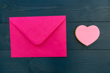 Love letter in pink envelope with love heart shape