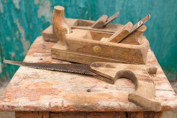 tools on an old wooden table, woodwork, cracks and scratches