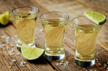 Tequila in glasses with lime and salt