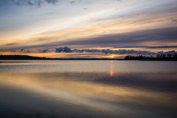 Fototapeta na wymiar Sunrise over the Swiecajty lake near Wegorzewo, Masuria, Poland