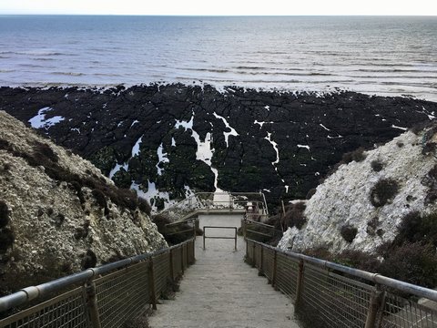 Steps down to the beach from cliffs in Peacehaven, East Sussex
